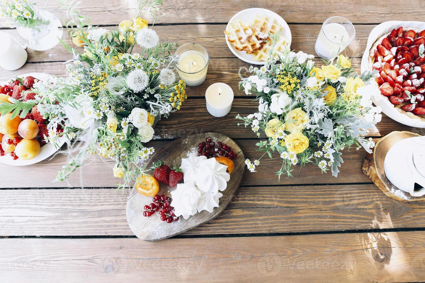 Appetizing breakfast on table on terrace photo