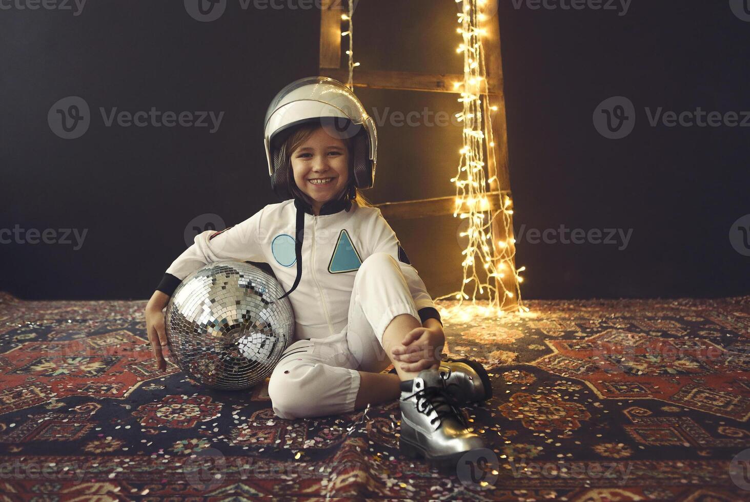 Astronaut futuristic kid girl with white full length uniform and helmet wearing silver shoes photo
