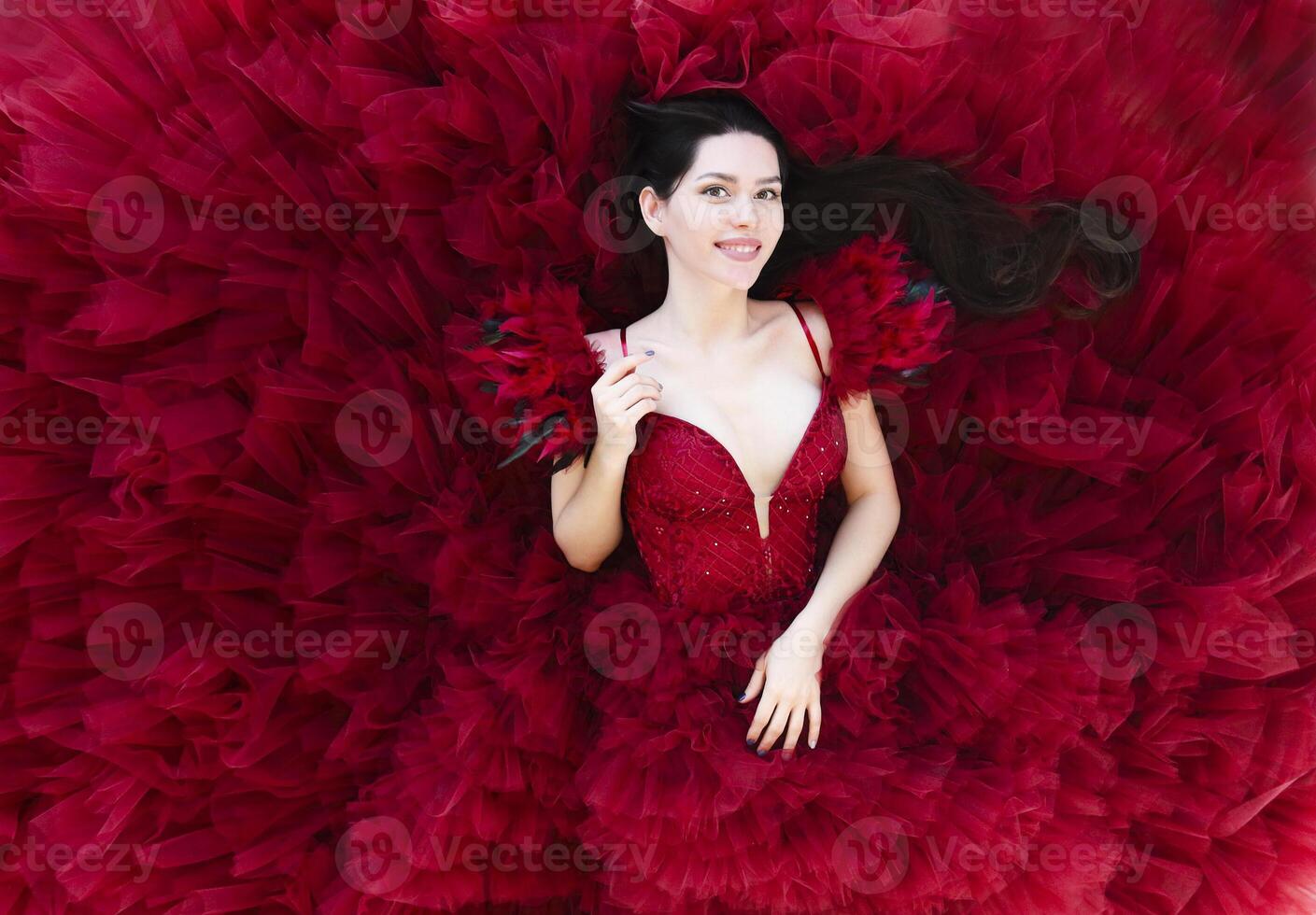 Gorgeous woman in red dress photo