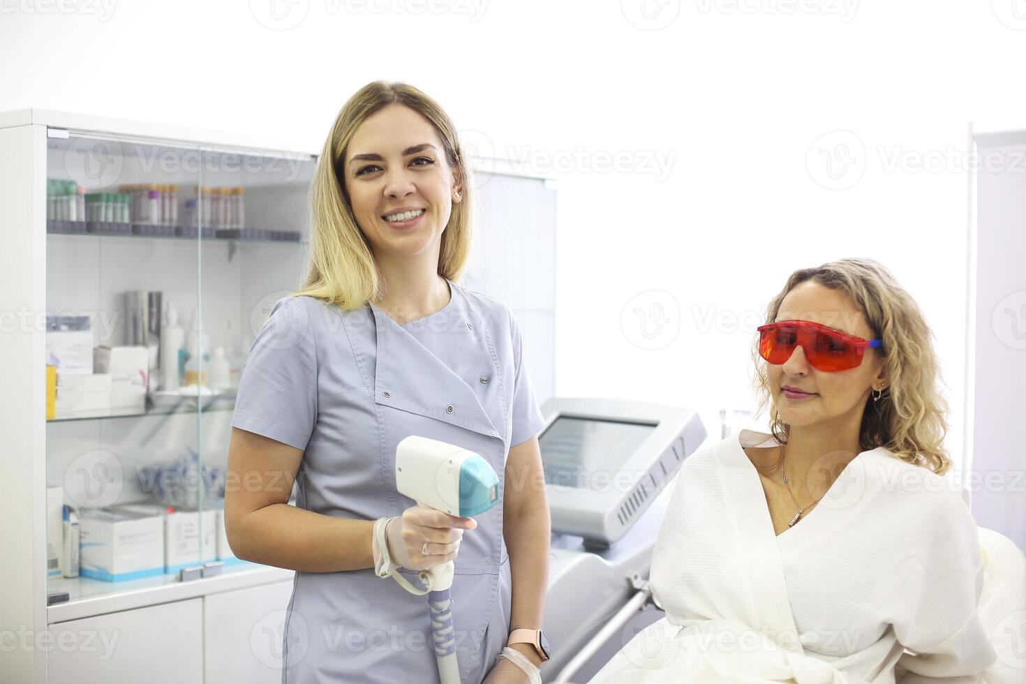 Woman on procedure of laser epilation photo