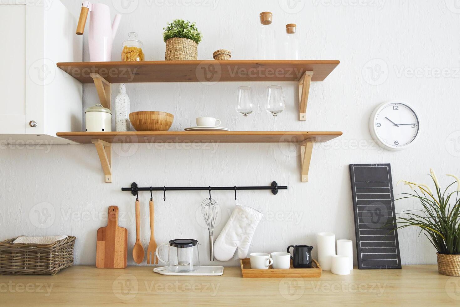 Interior of empty modern white kitchen with various objects photo