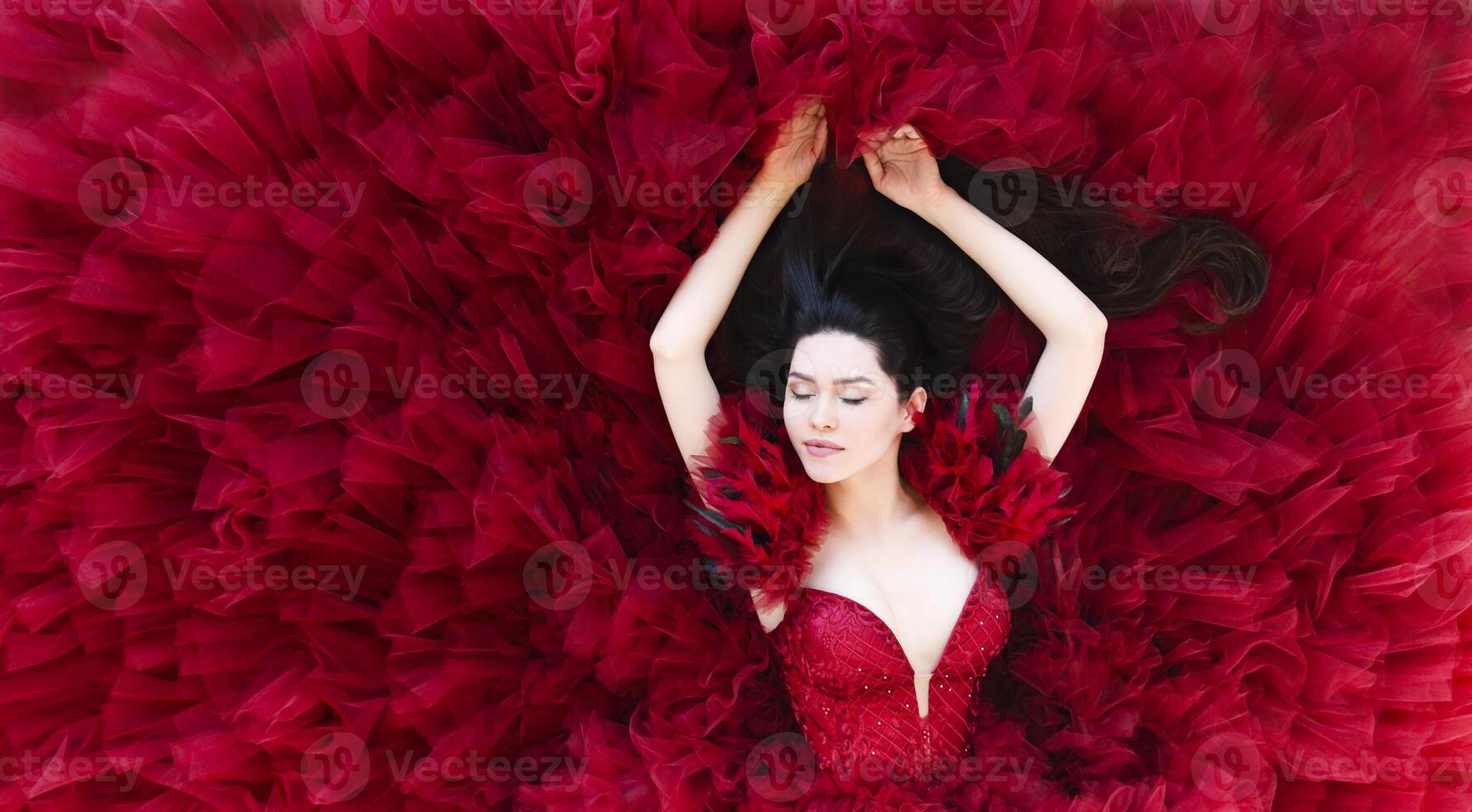 Gorgeous woman in red dress photo
