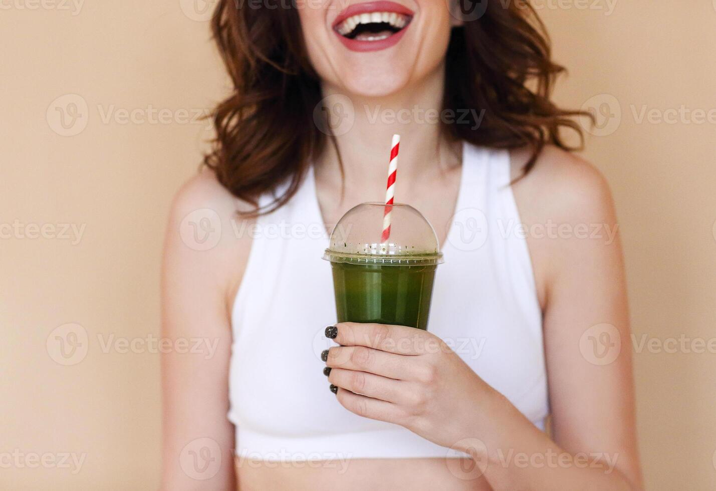 Crop happy woman with healthy drink photo