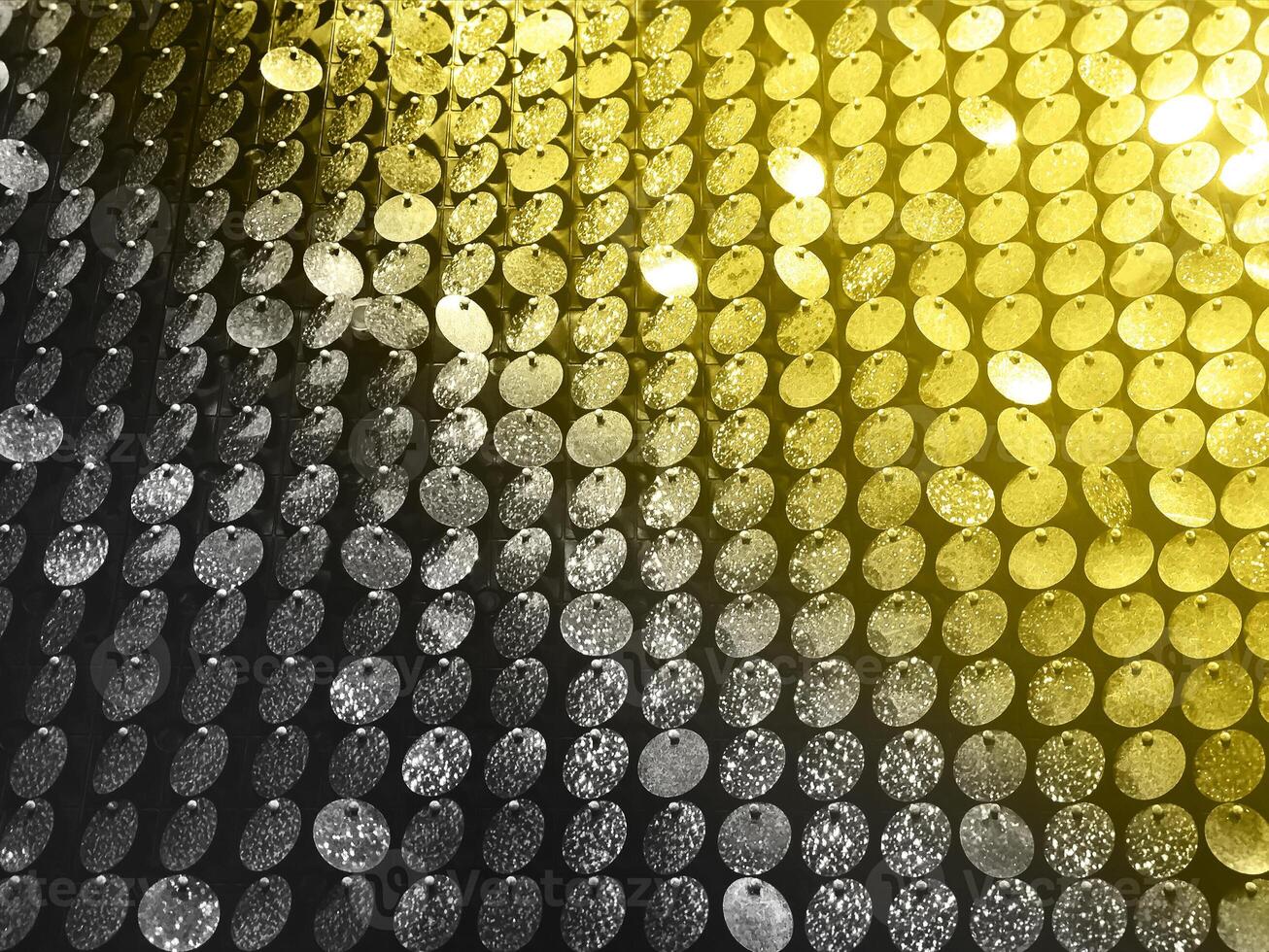 Colorful background of glowing sequins photo