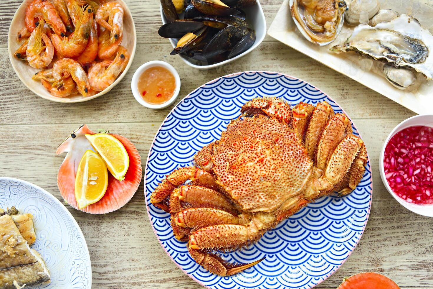 Freshly variety of sea food on the gray kitchen table photo