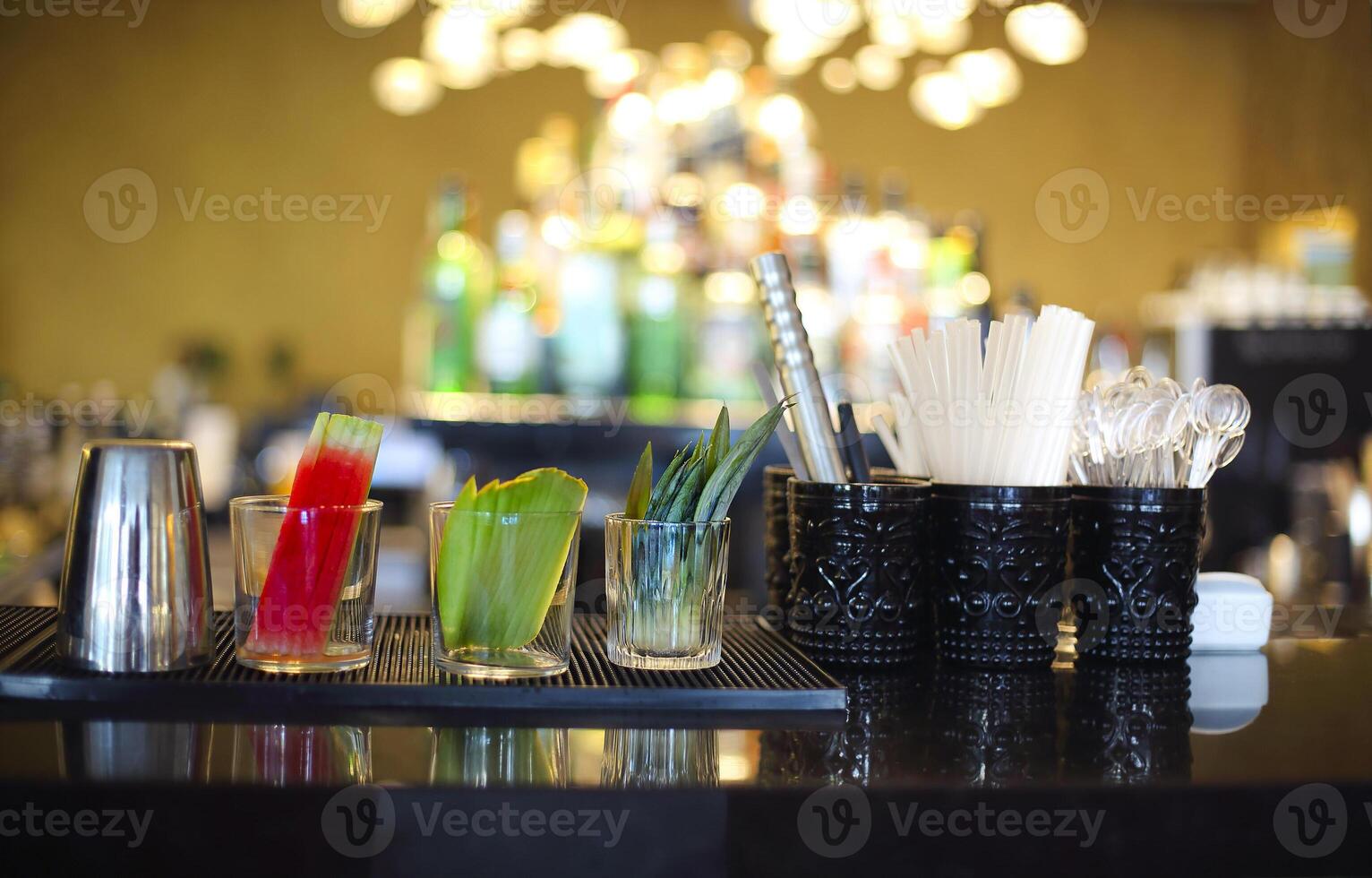 Bar counter with bottles in blurred background photo