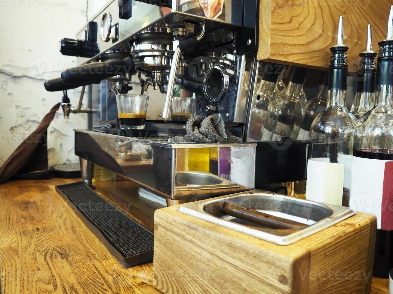 Espresso machine making coffee in pub, bar, restaurant photo