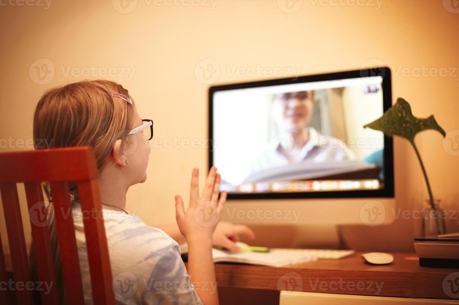 Unrecognizable girl ready to answer to online teacher photo