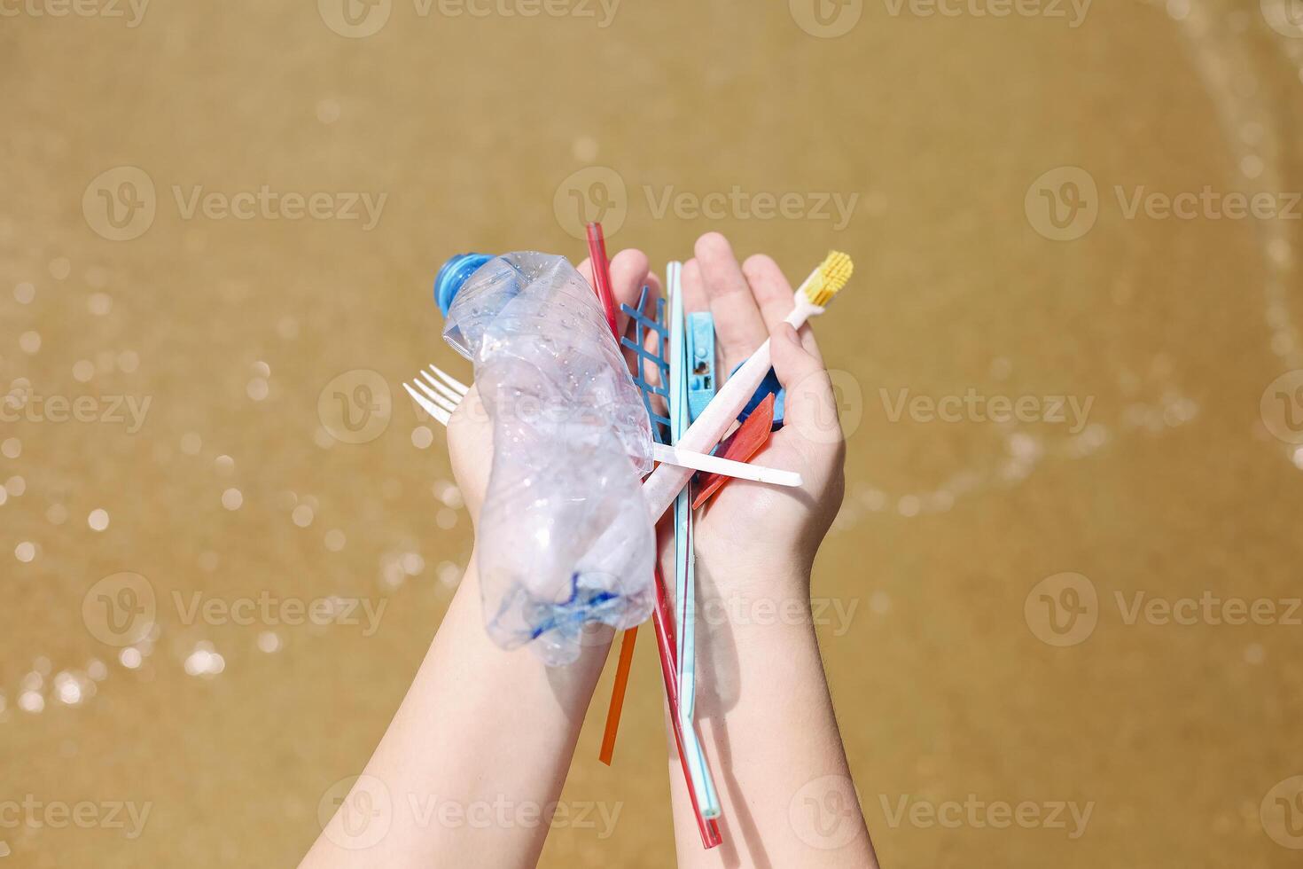 Volunteer collect trash, plastic garbage bottles on the beach. Ecology, environment, pollution and ecological problems concept photo