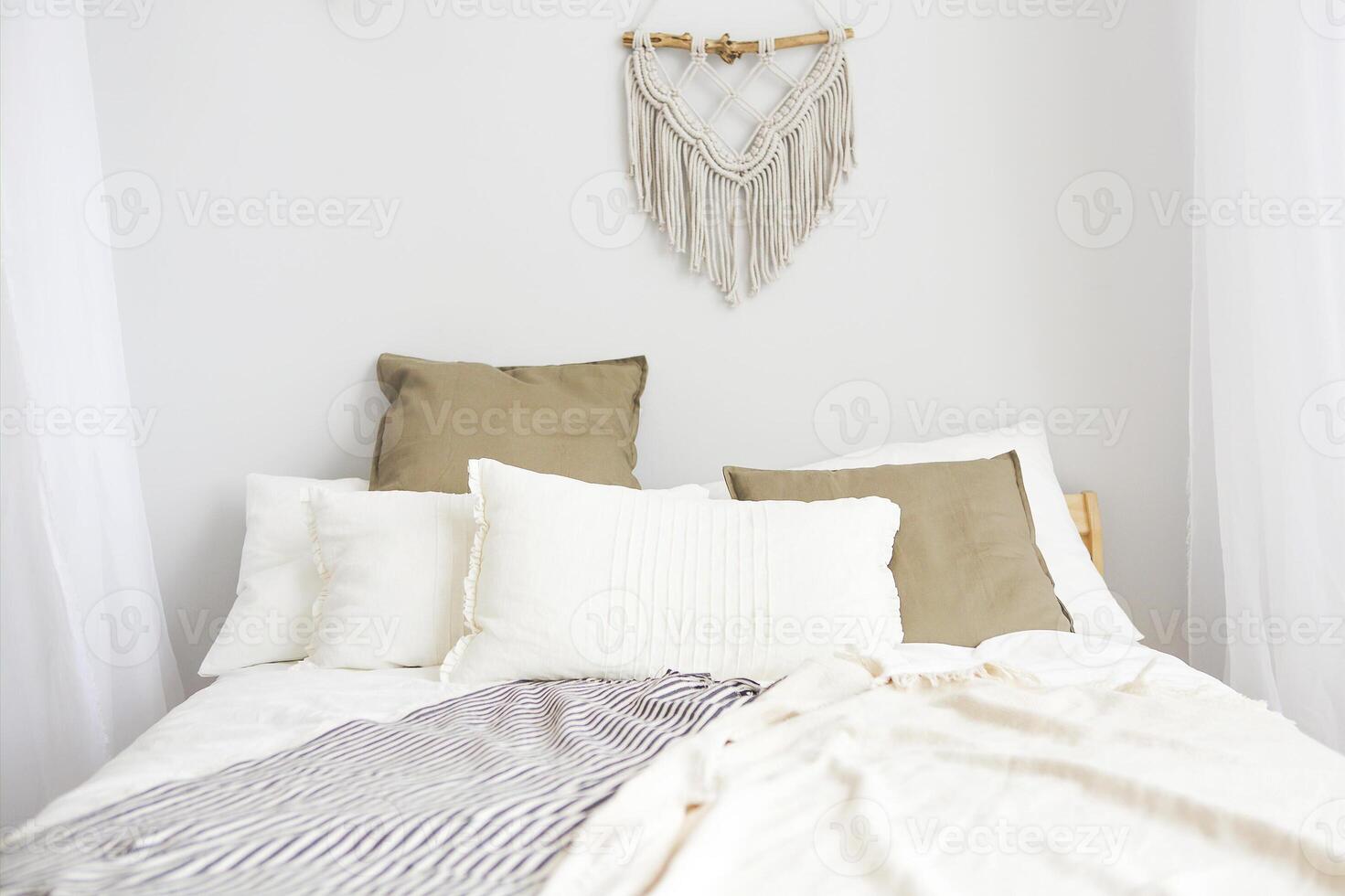 White and beige bedroom in boho style photo