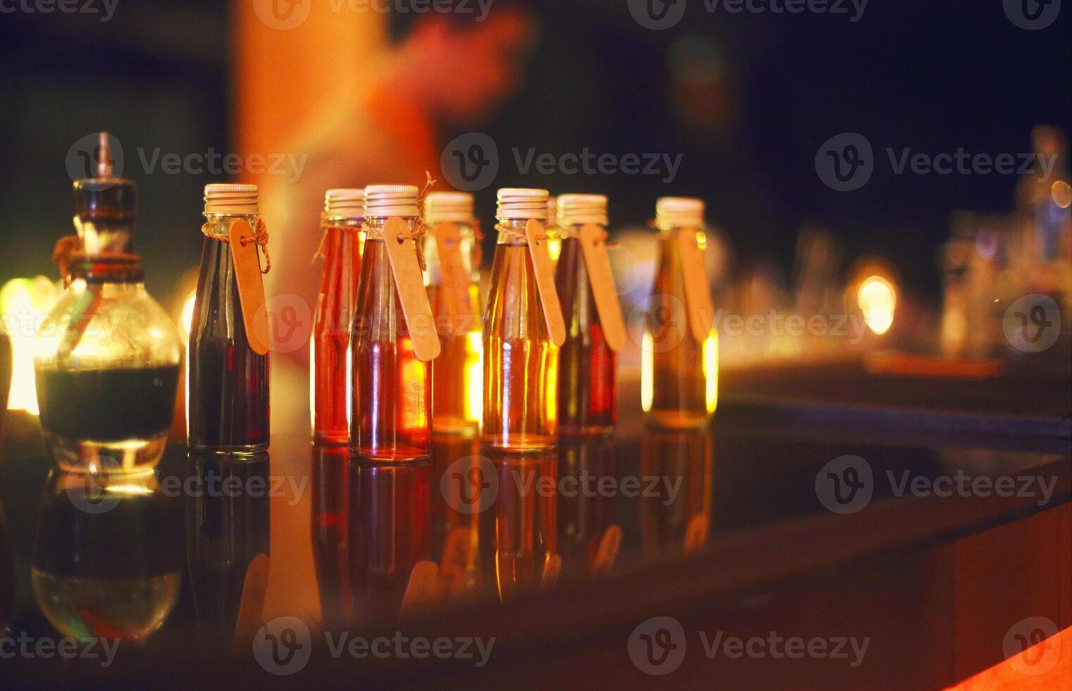 Classic bar counter with bottles in blurred background photo