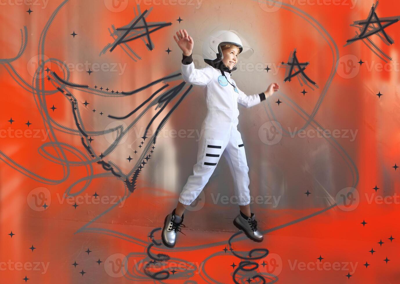 Little astronaut flying amidst stars photo