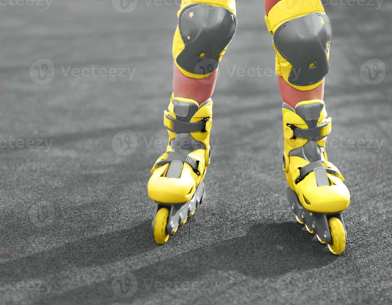 Rollerblades inline skates of a child closeup in action outdoors photo