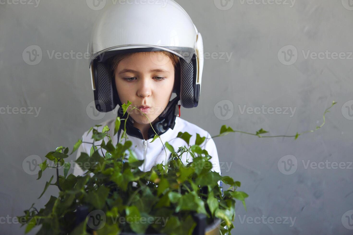 Astronaut futuristic kid girl wearing white uniform and helmet photo