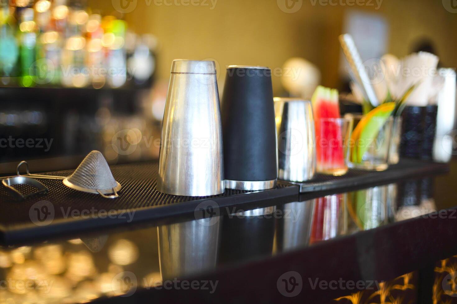 Bar counter with bottles in blurred background photo