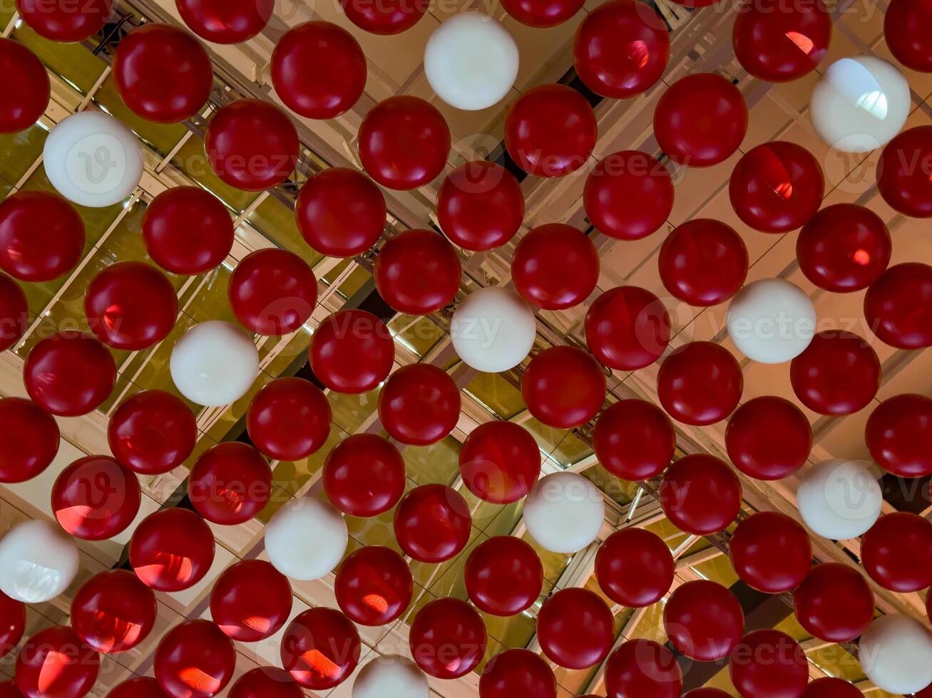 Colorful Red and White Spheres Ceiling Decor photo