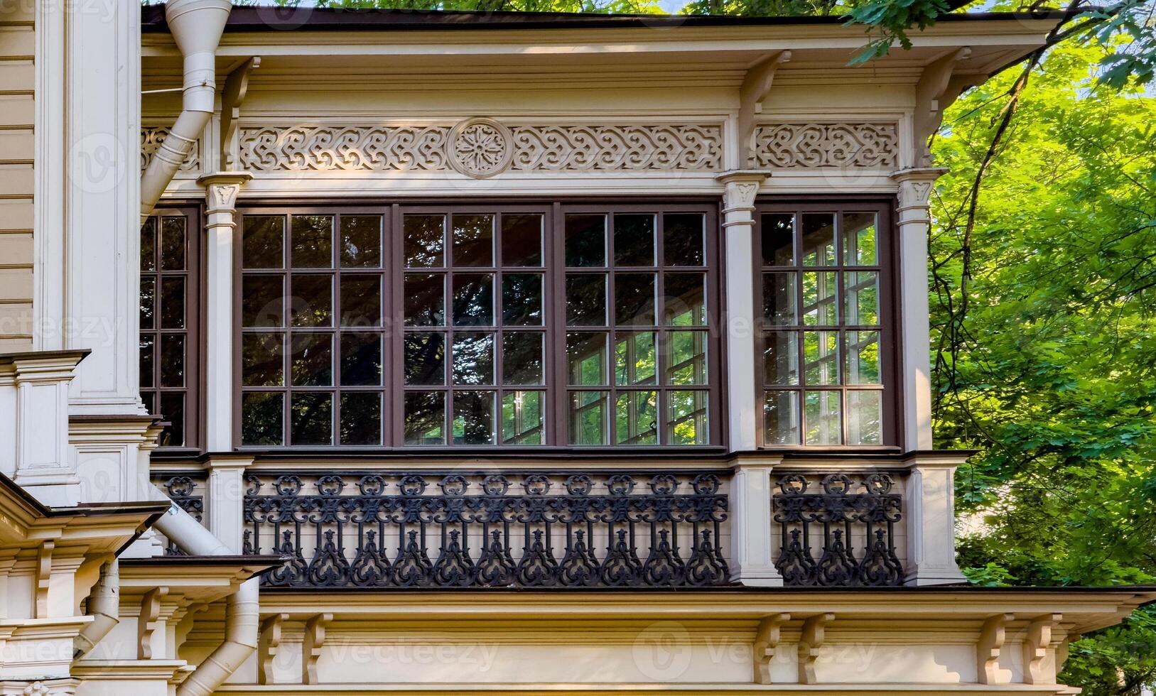 A beautifully preserved historic mansion in St. Petersburg, showcasing intricate architectural details and set against a backdrop of lush greenery. Perfect for themes of heritage, architecture, and cultural history photo