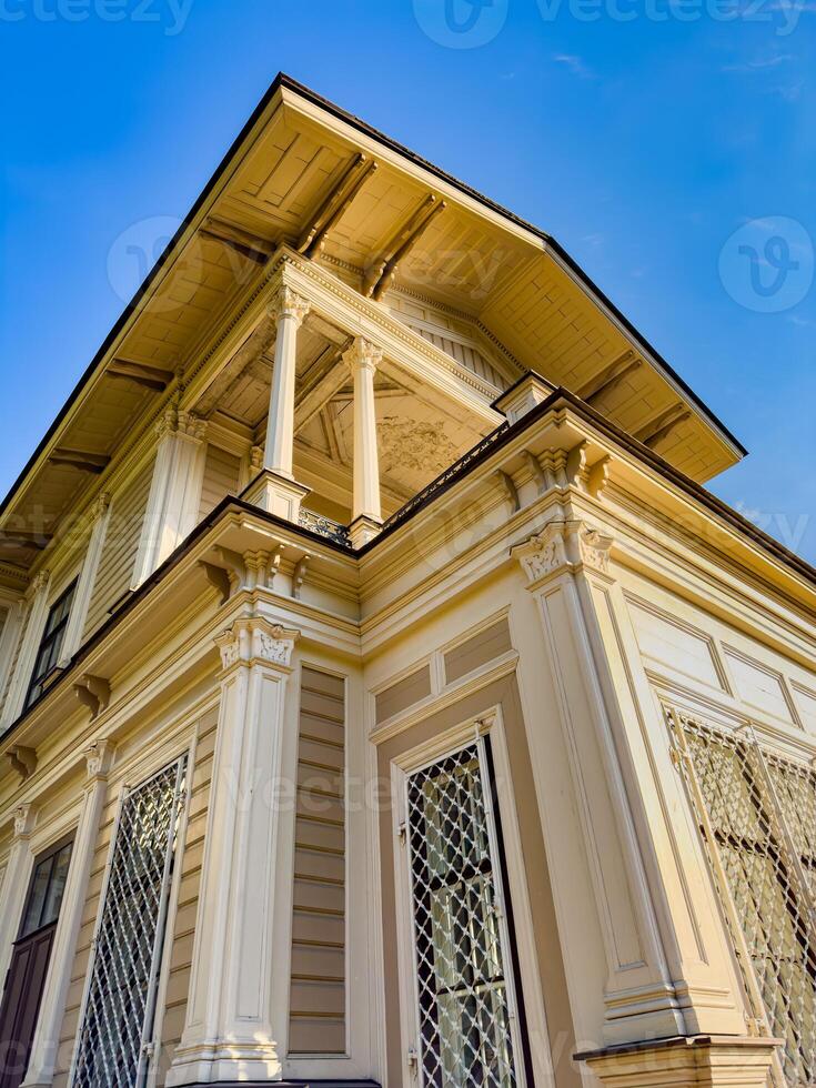 A beautifully preserved historic mansion in St. Petersburg, showcasing intricate architectural details and set against a backdrop of lush greenery. Perfect for themes of heritage, architecture, and cultural history photo