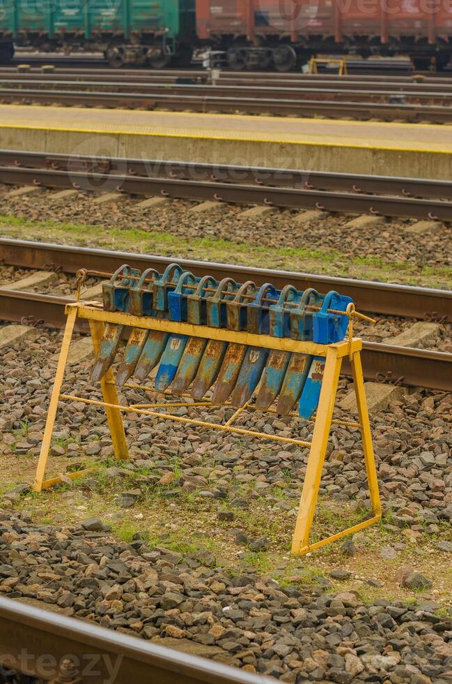 The brake shoe is on the rail under the wheel of the wagon with a rolling. High quality photo