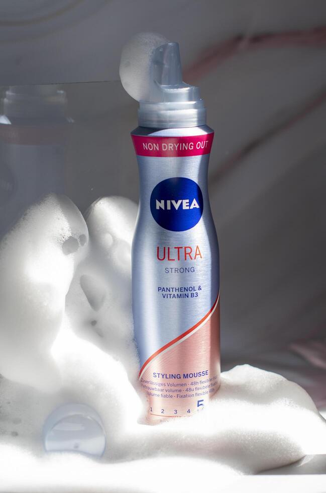 Nivea hair fixing ultra stong styling mousse in foam and sunshine, close-up photo of the product, As,Belgium, Juny 30, 2022, High quality photo,