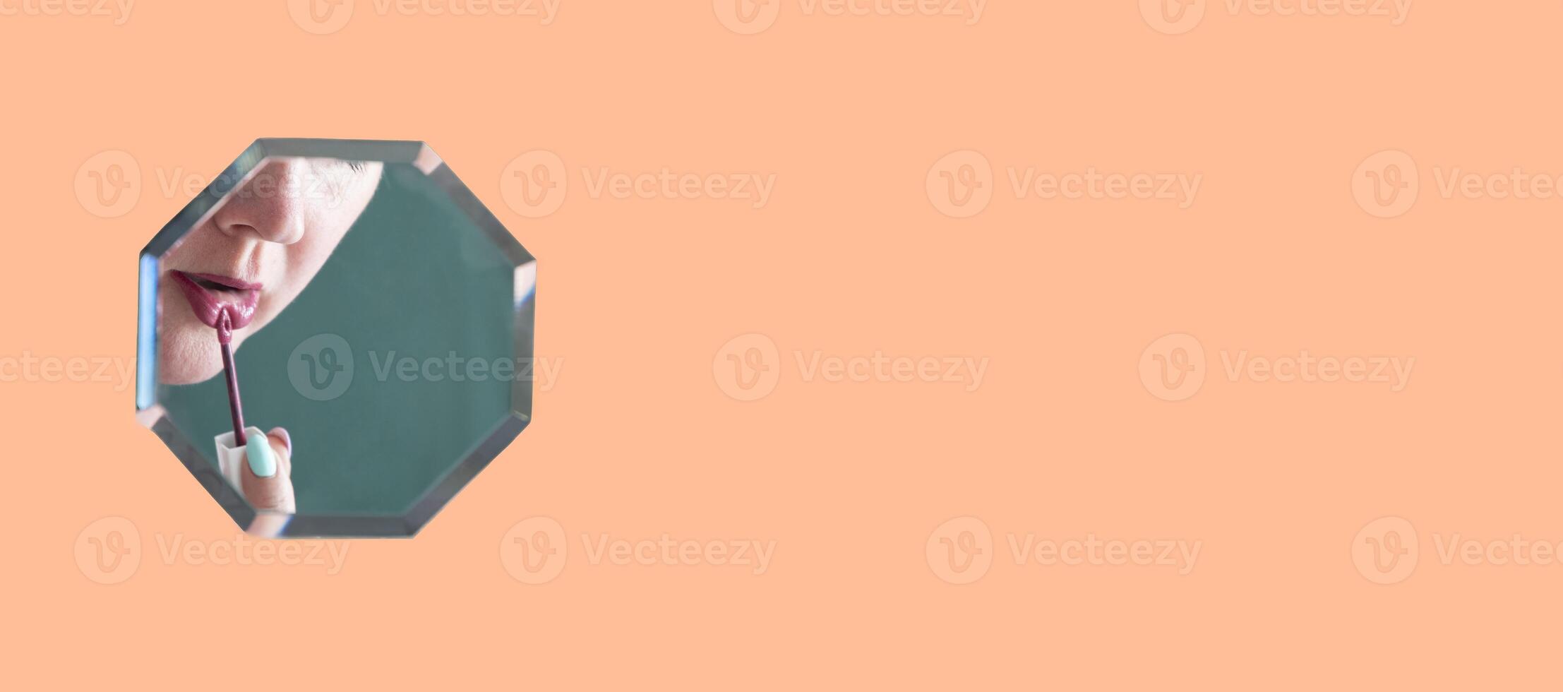 reflection of a woman in the mirror who paints her lips with lipstick, mirror hanging in zero gravity on peach fuzz background, High quality photo