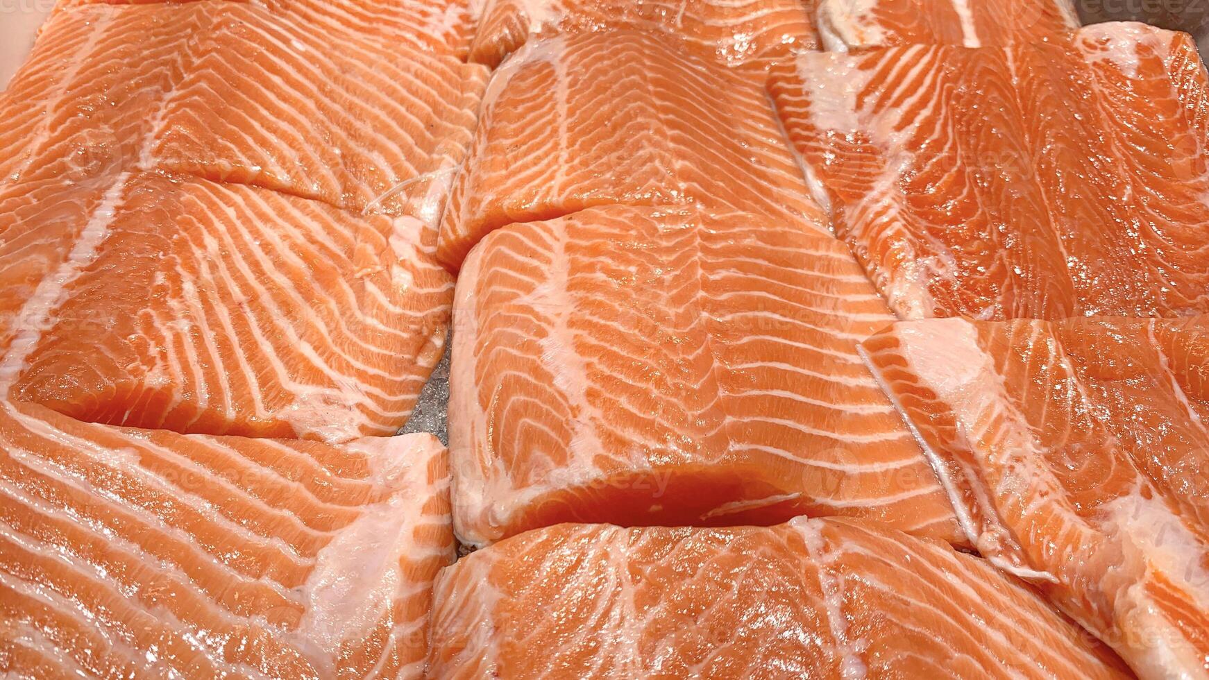 Top view of fresh salmon fish fillet displayed in wet market. photo