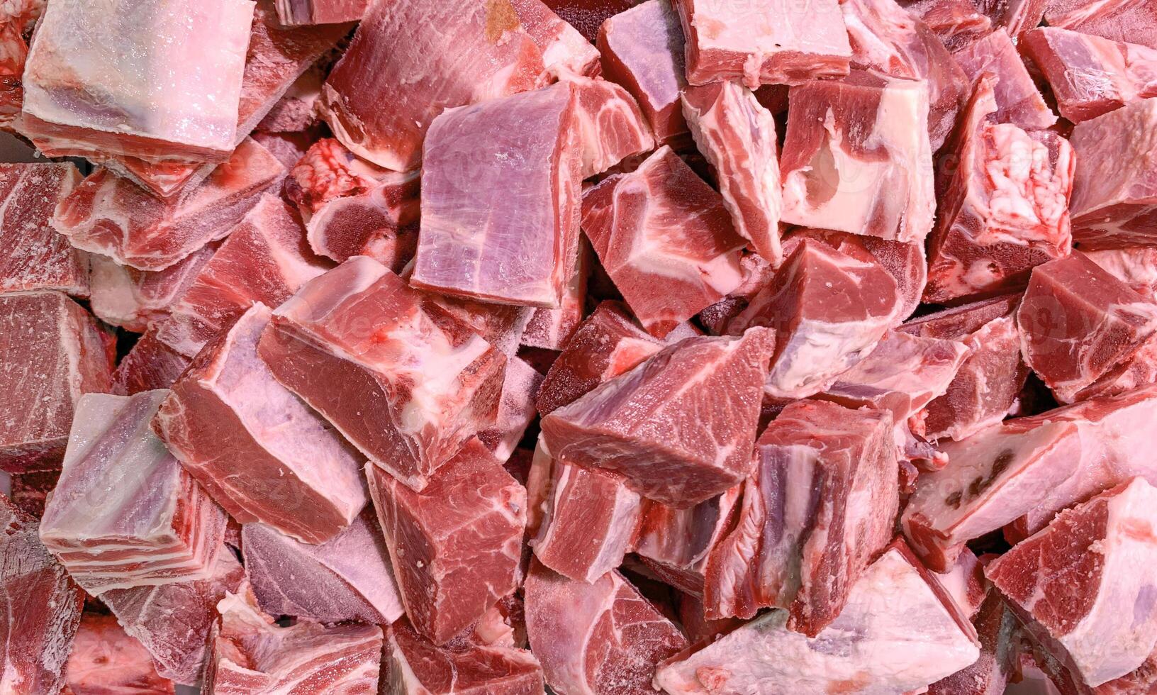 Top view of lamb meat displayed in retail store. photo