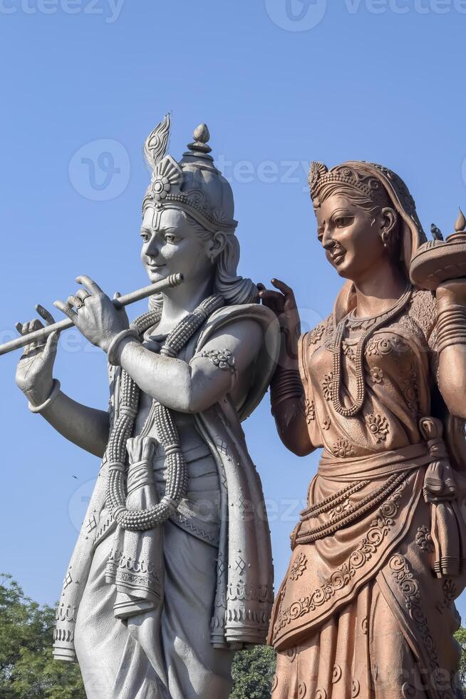 Big statue of Lord Radha Krishna near Delhi International airport, Delhi, India, Lord Krishna and Radha big statue touching sky at main highway Mahipalpur, Delhi photo