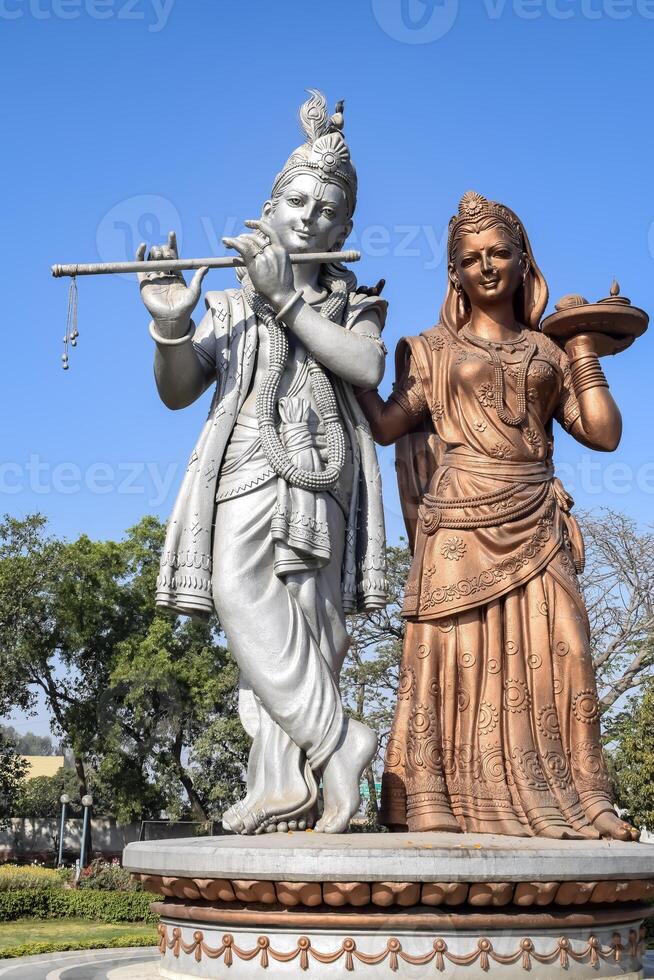 Big statue of Lord Radha Krishna near Delhi International airport, Delhi, India, Lord Krishna and Radha big statue touching sky at main highway Mahipalpur, Delhi photo
