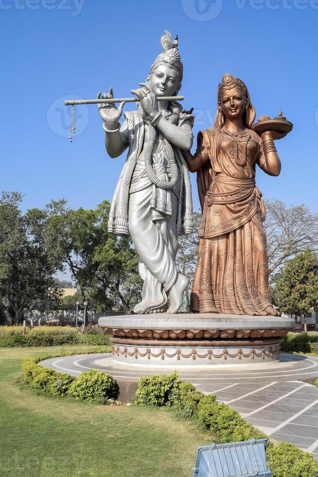 Big statue of Lord Radha Krishna near Delhi International airport, Delhi, India, Lord Krishna and Radha big statue touching sky at main highway Mahipalpur, Delhi photo