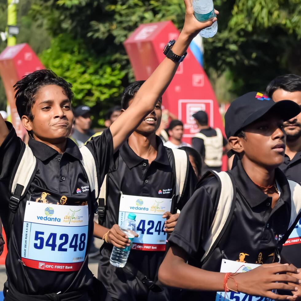 New Delhi, India - July 15 2024 - Vedanta Delhi Half Marathon race after covid in which marathon participants about to cross the finish line, Delhi Half Marathon 2023 photo