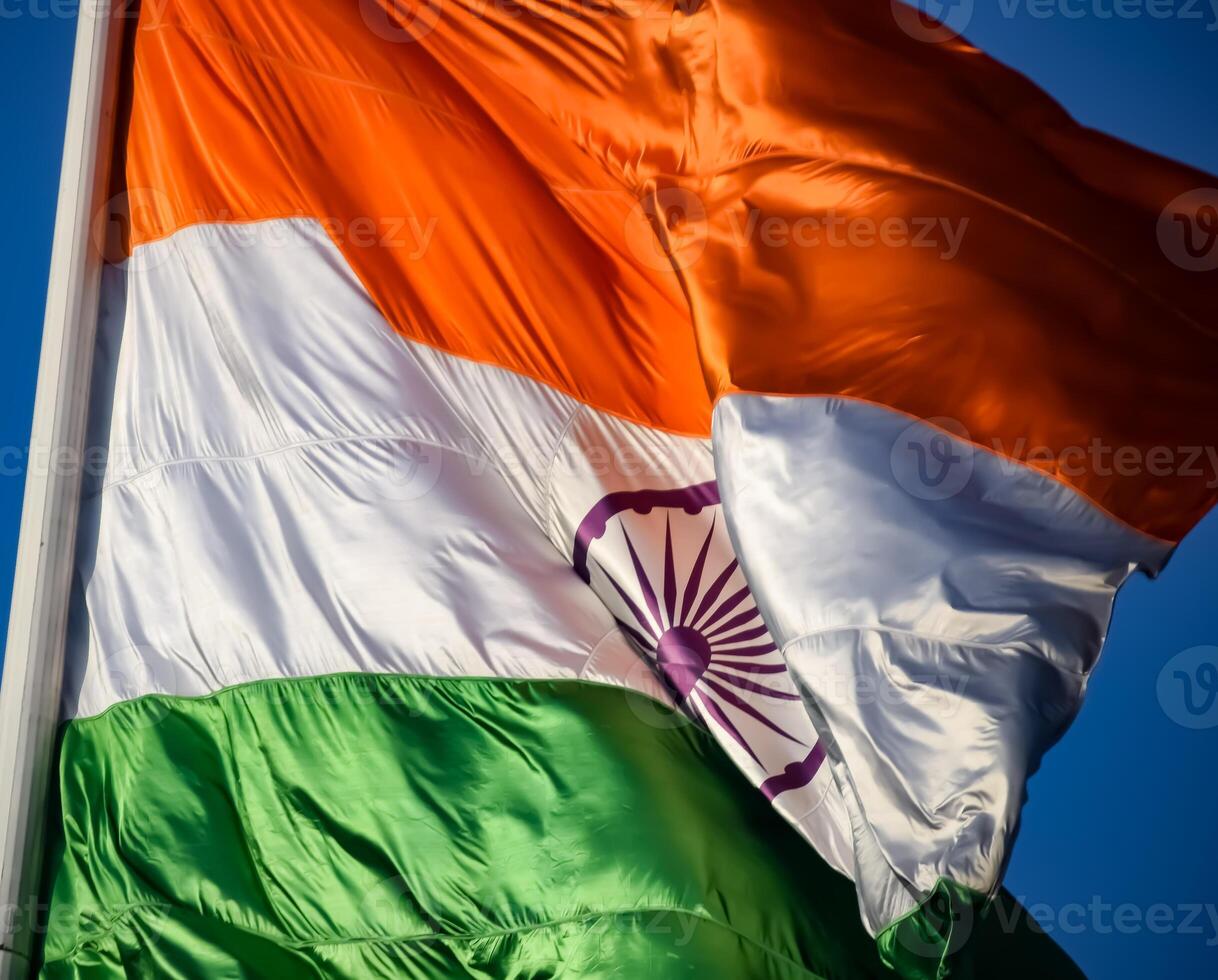 India flag flying high at Connaught Place with pride in blue sky, India flag fluttering, Indian Flag on Independence Day and Republic Day of India, tilt up shot, Waving Indian flag, Har Ghar Tiranga photo