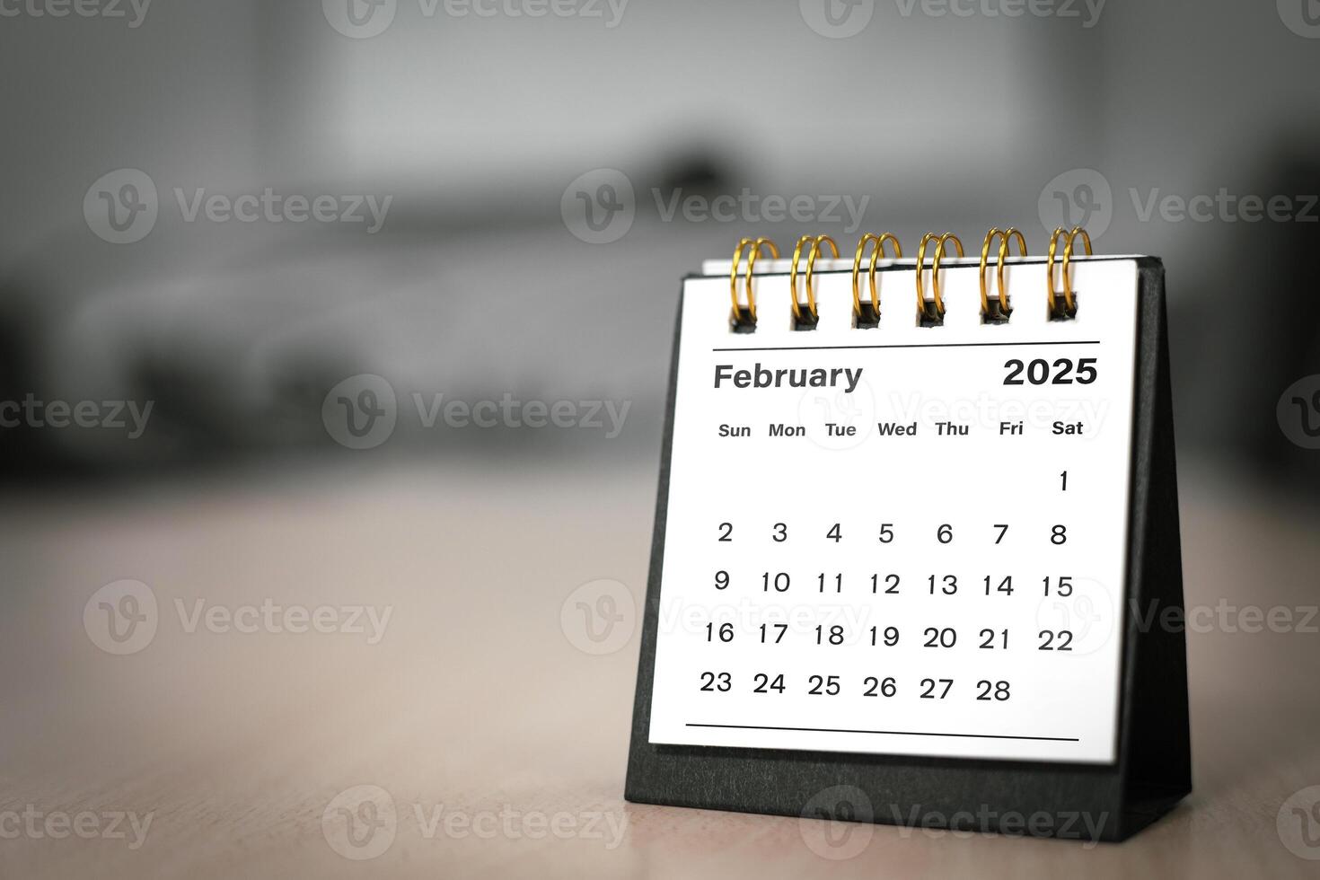 Calendar page February of the year 2025 white color in meeting room in office. with copy space and business design. concept of planning and setting new strategic goals. photo