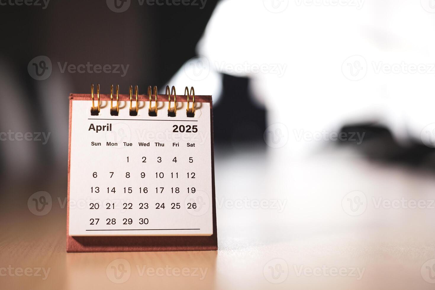 Calendar page April of the year 2025 white color in meeting room in office. with copy space and business design. concept of planning and setting new strategic goals. photo