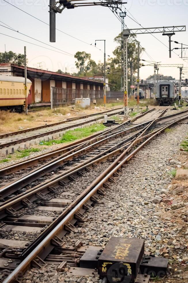 View of train Railway Tracks from the middle during daytime at Amritsar railway station in India, Train railway track view, Indian Railway junction, Heavy industry photo