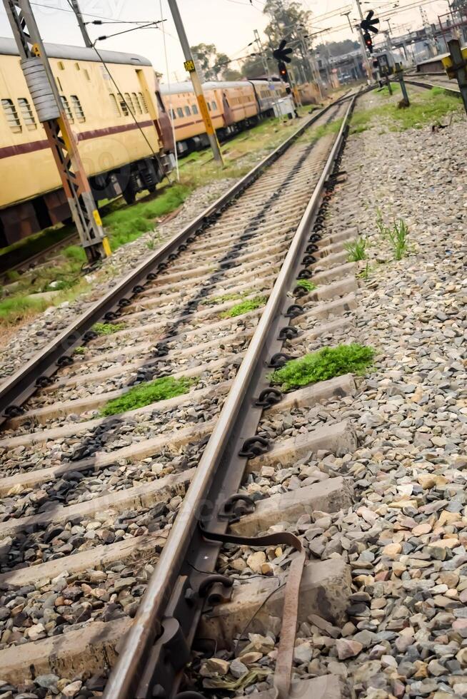 View of train Railway Tracks from the middle during daytime at Amritsar railway station in India, Train railway track view, Indian Railway junction, Heavy industry photo