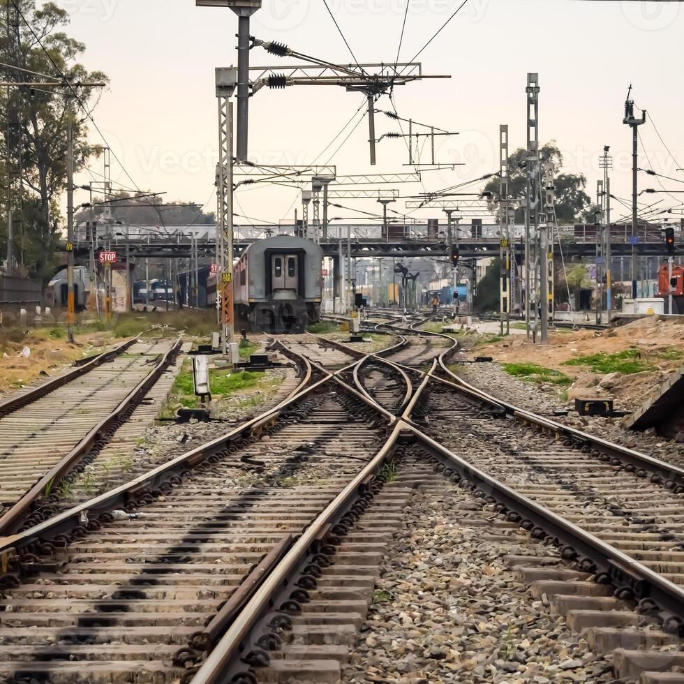 View of train Railway Tracks from the middle during daytime at Amritsar railway station in India, Train railway track view, Indian Railway junction, Heavy industry photo