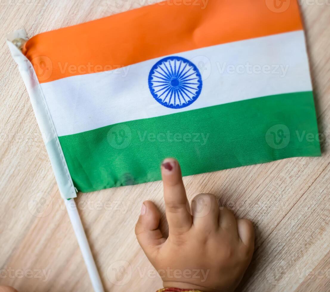 Young voter showing her ink-marked fingers after casting votes near polling booth of east Delhi, India for general Lok Sabha Elections 2024 photo