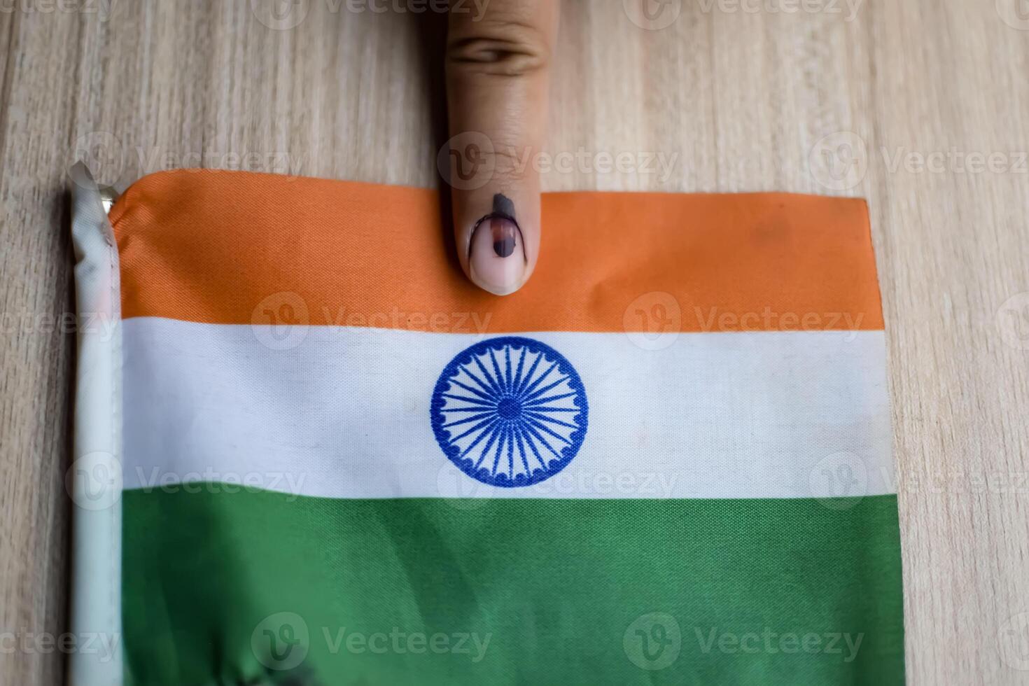 Young voter showing her ink-marked fingers after casting votes near polling booth of east Delhi, India for general Lok Sabha Elections 2024 photo