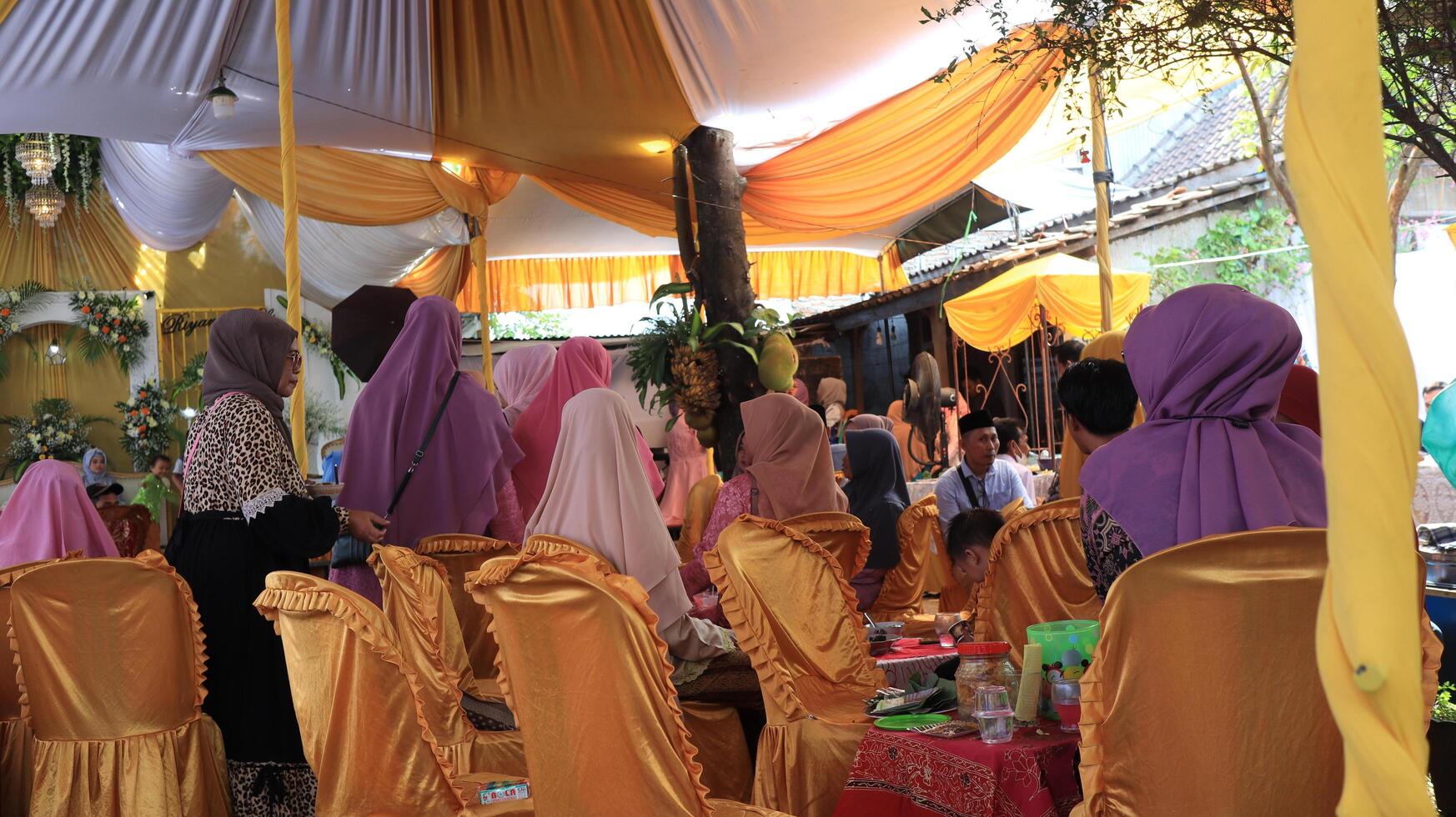 Guests enjoying a traditional wedding party photo