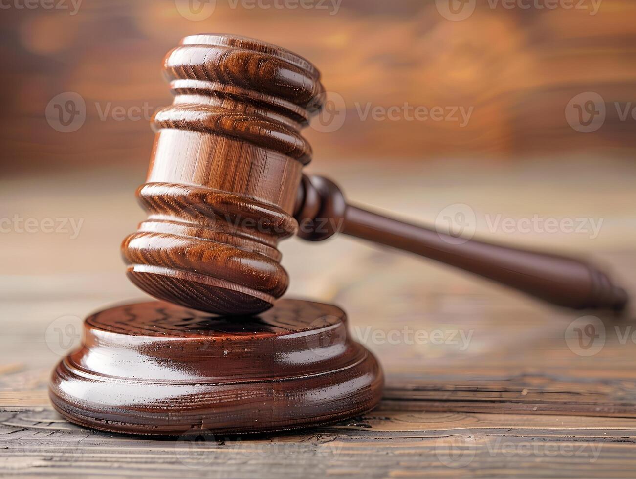 Wooden judge's gavel on the table as a trial concept photo