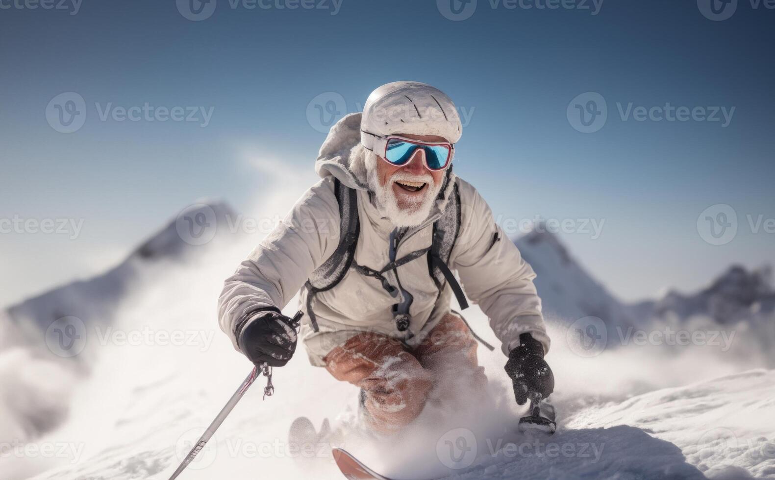 An adventurous elderly man with a distinguished gray beard showcases his seasoned skiing skills on the breathtaking snowy peaks of a mountainous landscape photo