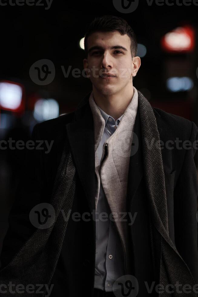 Smiling Meedle Eastern man walking down street near modern office building, photo