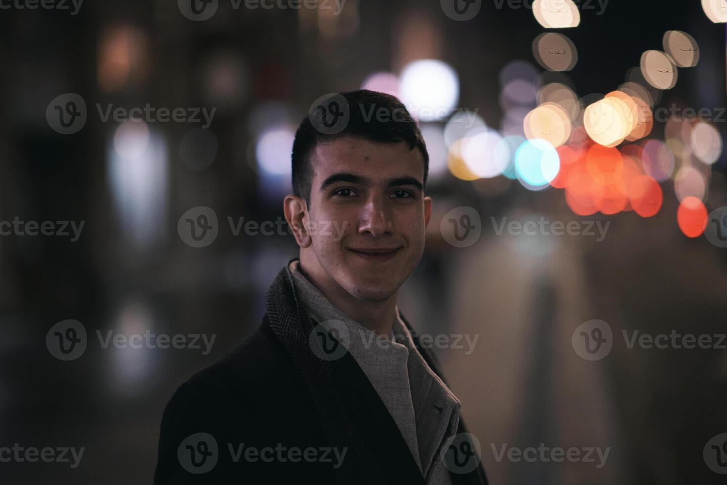 Smiling Meedle Eastern man walking down street near modern office building, photo