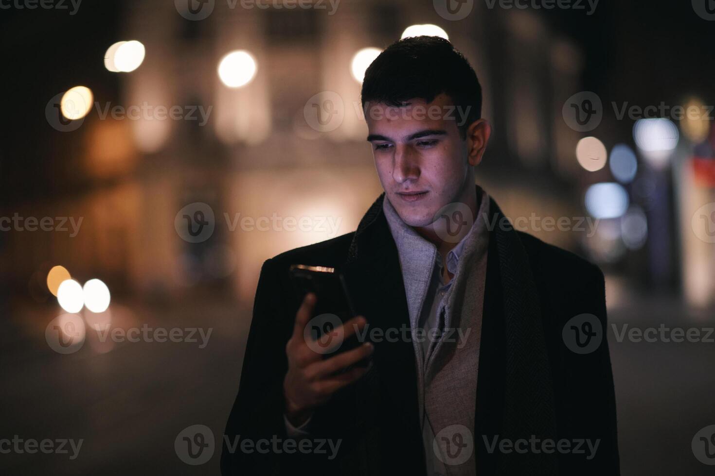 Smiling Meedle Eastern man walking down street near modern office building, photo