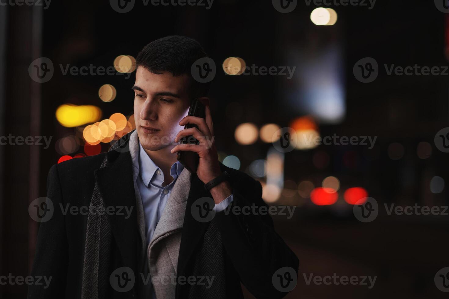 Smiling Meedle Eastern man walking down street near modern office building, photo