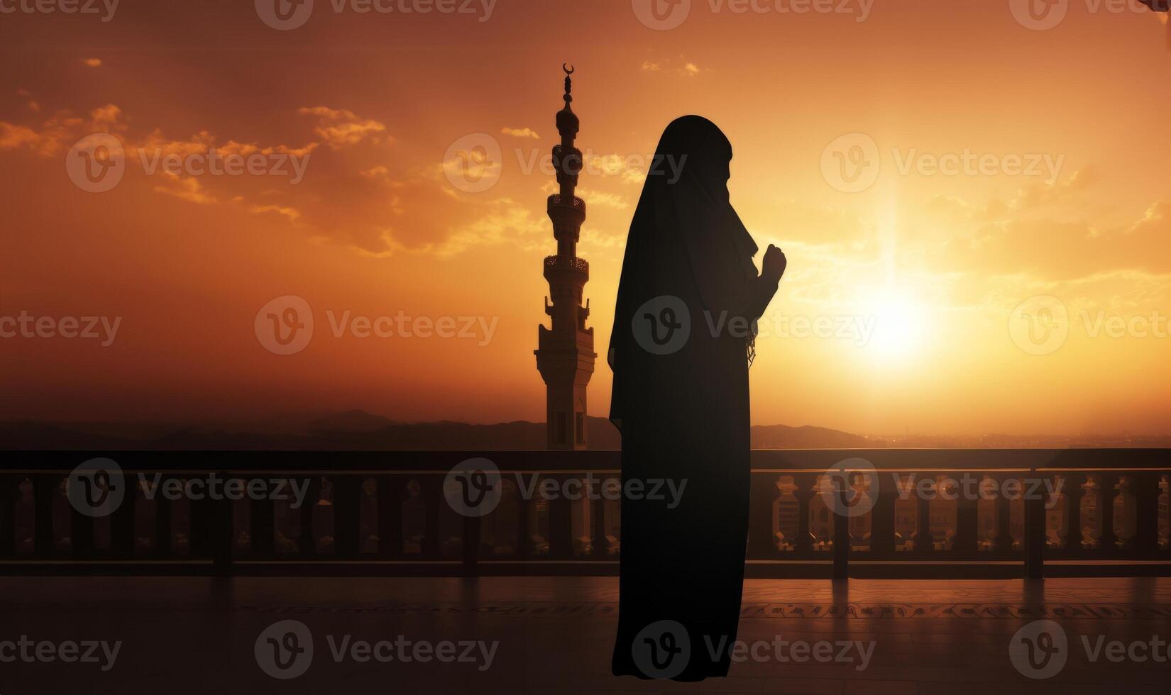 Silhouettes of a Muslim man and woman praying at a sacred site, bathed in the golden light of sunrise and sunset.Generated image photo