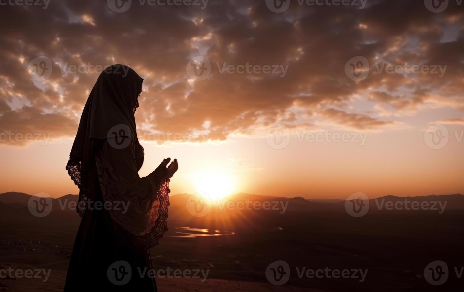 Silhouettes of a Muslim man and woman praying at a sacred site, bathed in the golden light of sunrise and sunset.Generated image photo