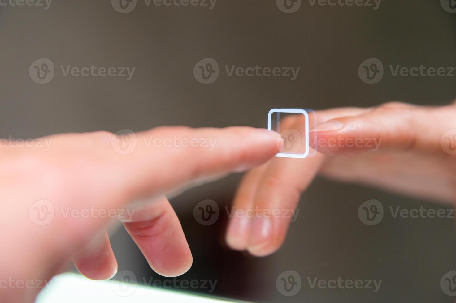 Using a mirror with touch screen function. young woman in a home goods store or at home in the toilet photo