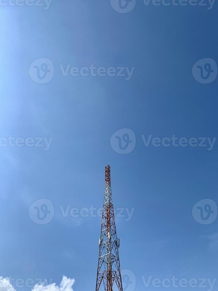 a large tower with a red and white antenna photo